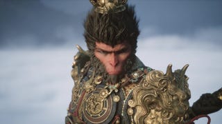 Sun Wukong sits atop a cloud in regal armour and stares at an unknown enemy in Black Myth: Wukong.