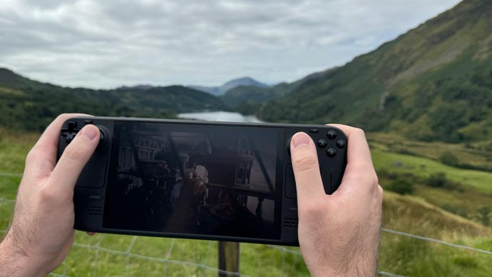 A Steam Deck OLED being played outdoors.